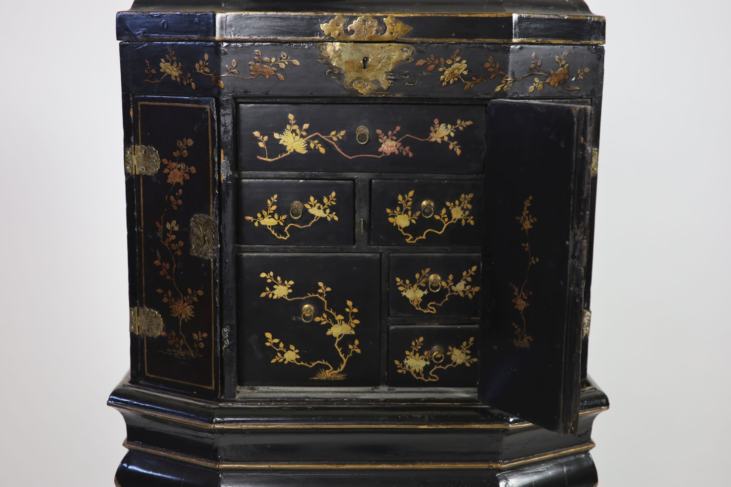 An 18th century Japanese black lacquered table cabinet on stand H 123cm. W 56cm. D 38cm.